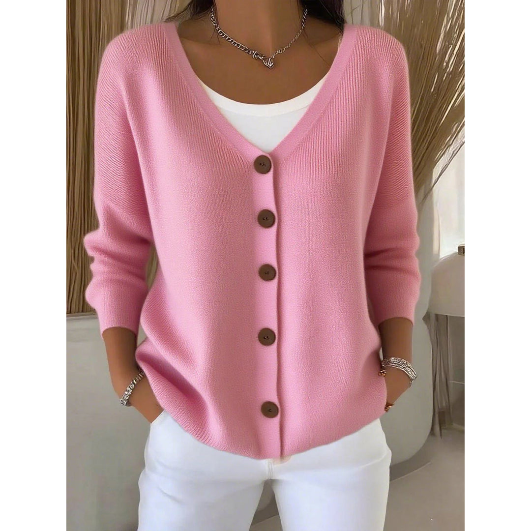 Woman wearing a pink button-front cardigan