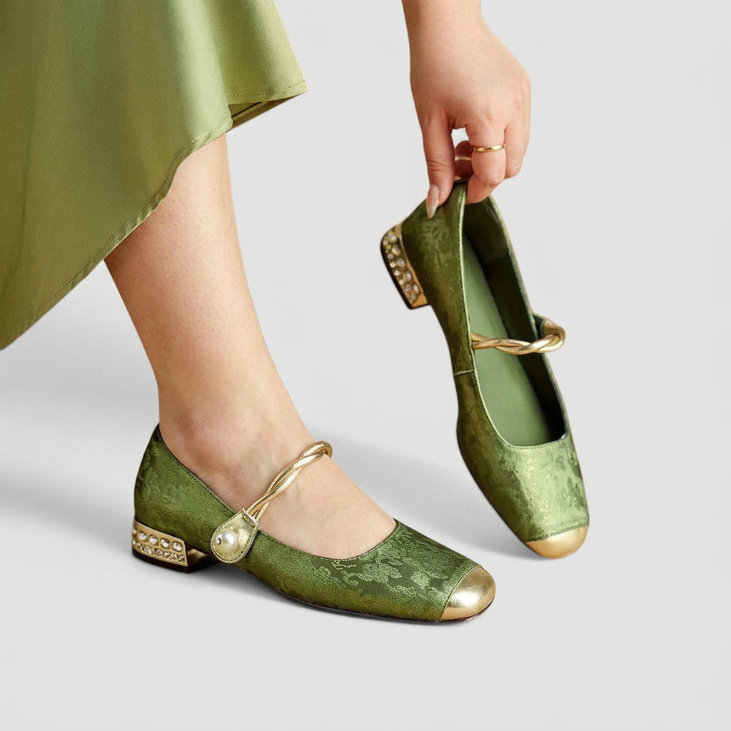 Woman holding green Mary Jane flats
