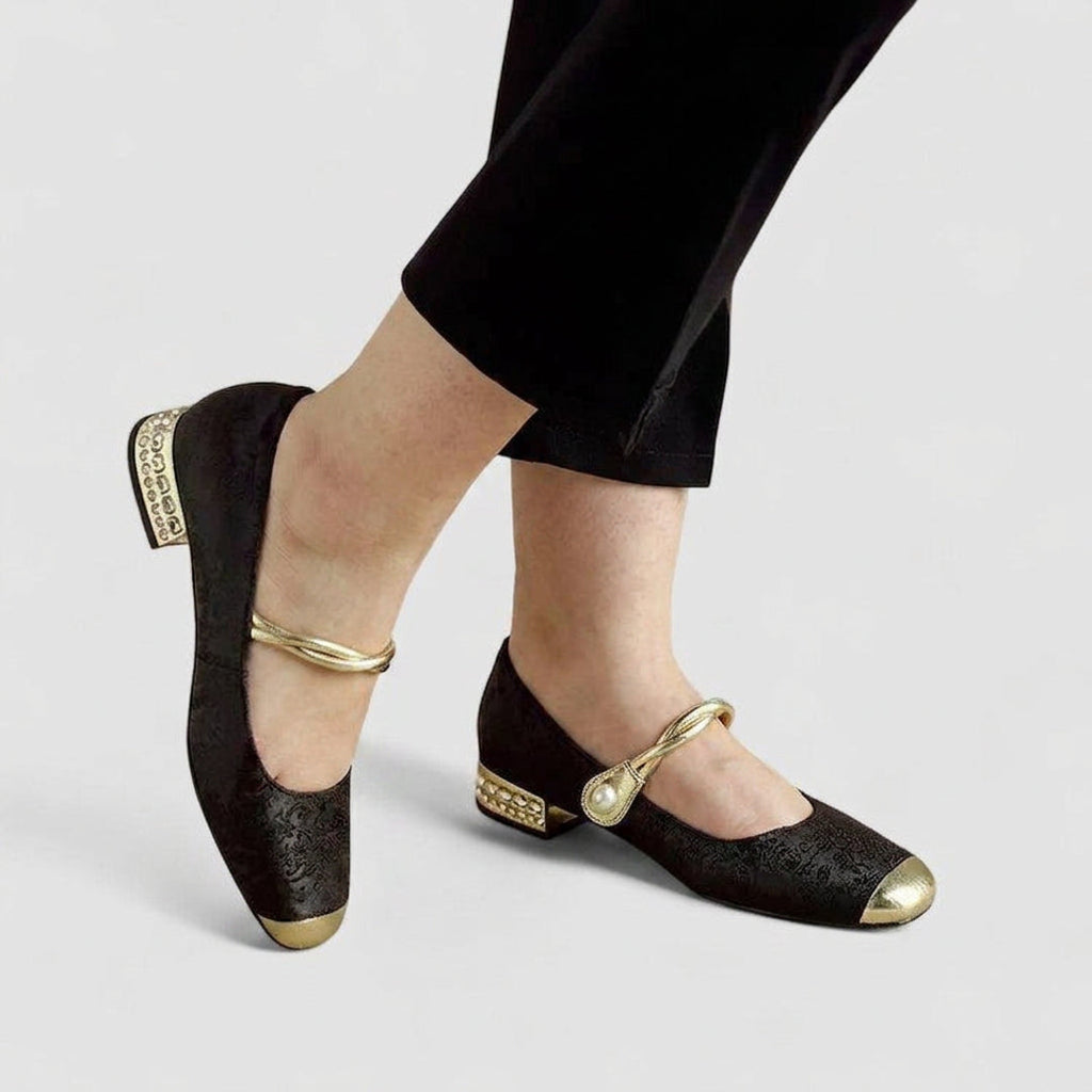 Woman wearing black Mary Jane flats with trousers