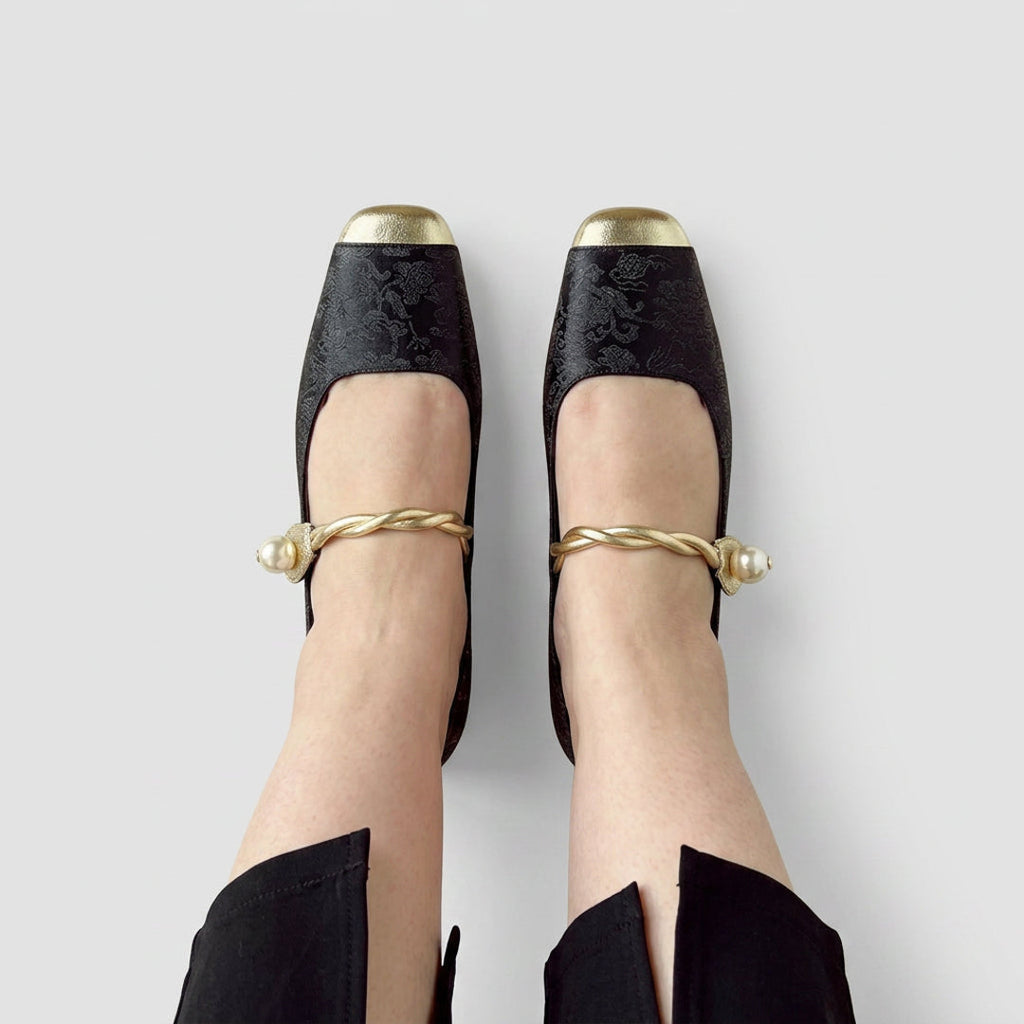 Black Mary Jane flats with metal toe cap