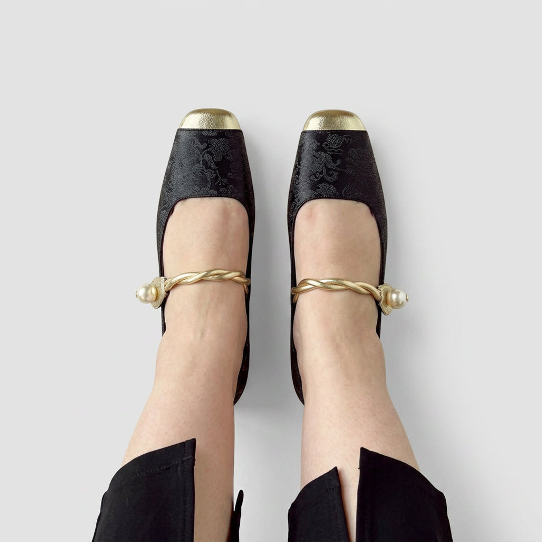 Black Mary Jane flats with metal toe cap