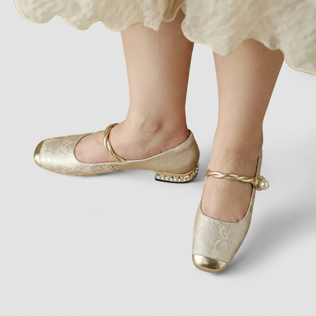 Woman wearing beige metallic Mary Jane flats