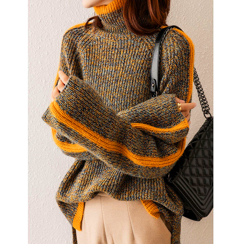 Woman wearing the olive turtleneck with a bag