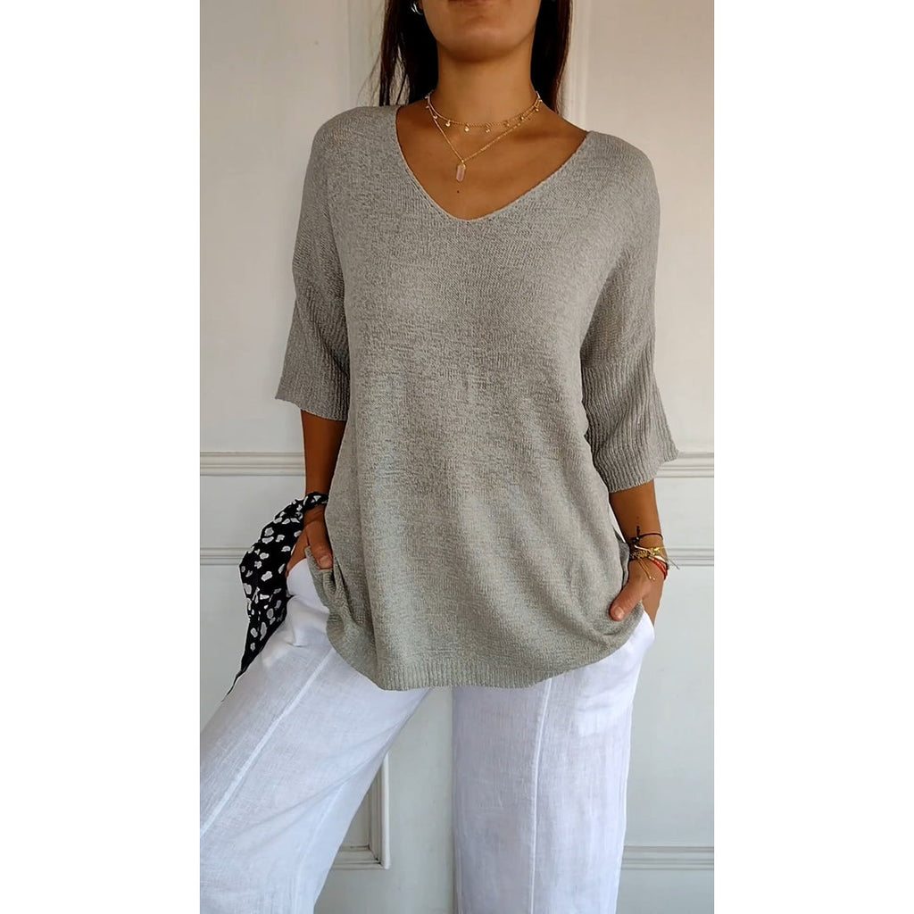 Women's grey V-neck knit tunic top