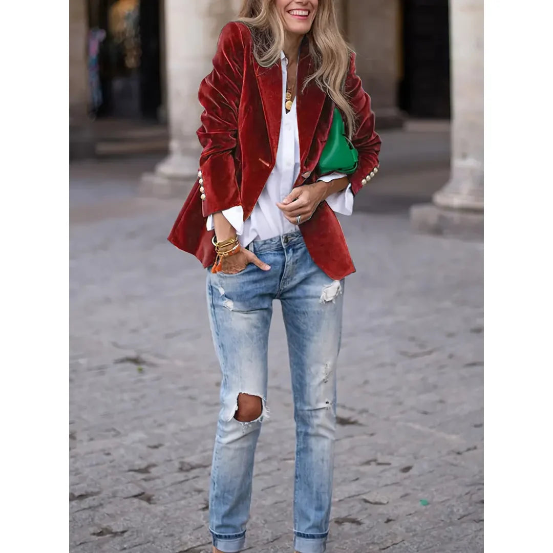 Woman wearing a red velvet-look blazer