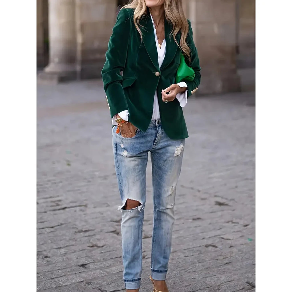 Woman wearing a green velvet-look blazer