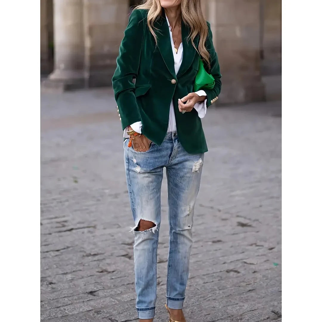 Woman wearing a green velvet-look blazer