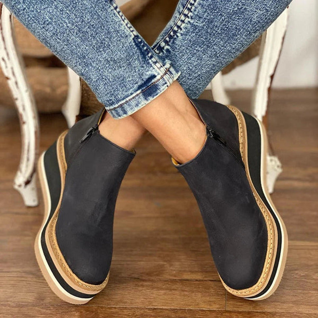 Black platform ankle boots with side zip