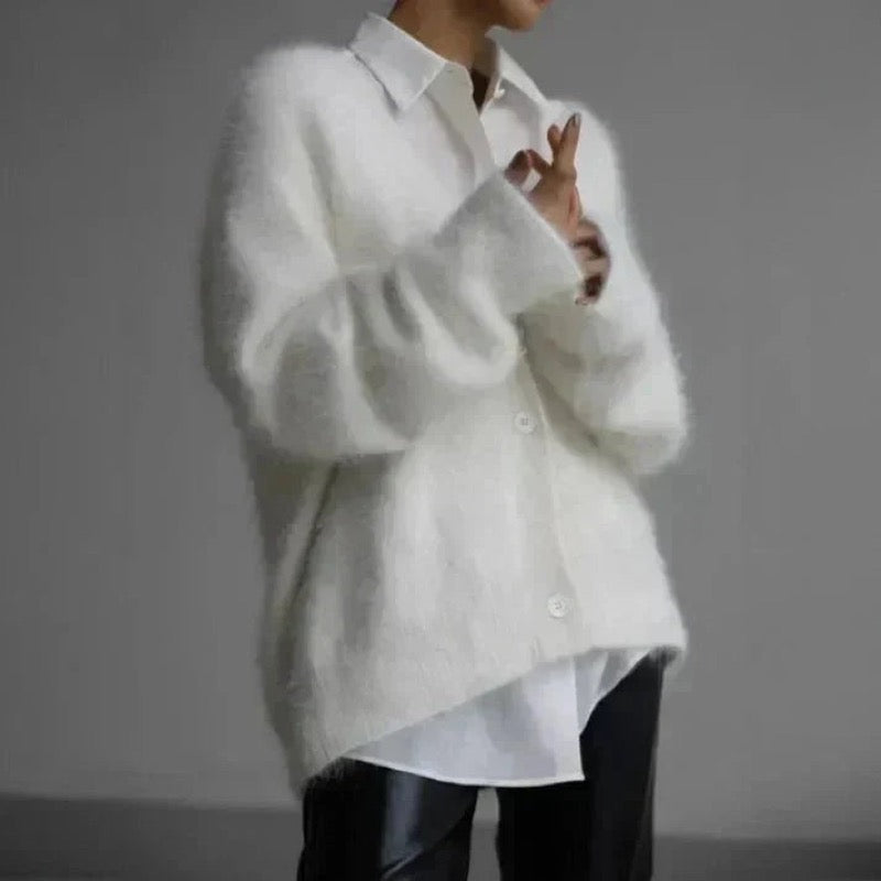 White fluffy button cardigan over a white shirt