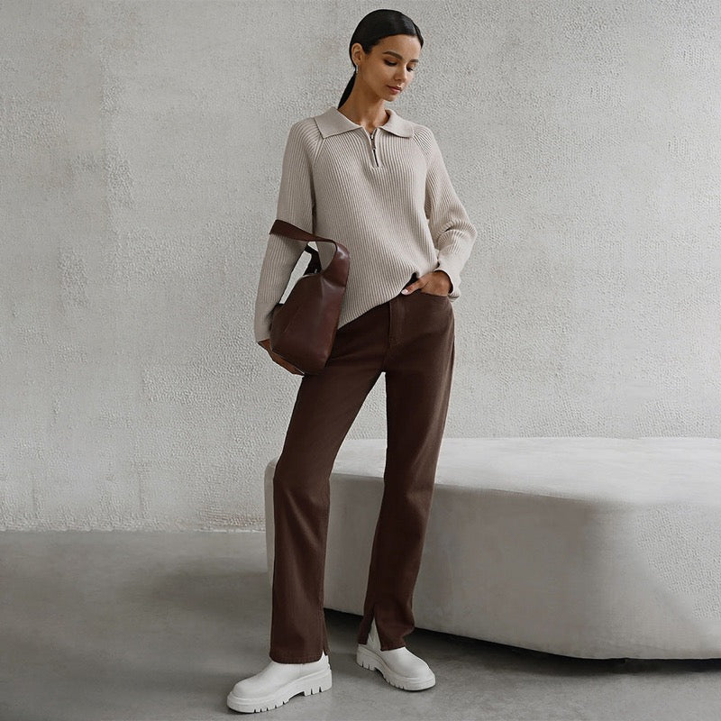 Beige ribbed zip-neck sweater with brown trousers – full length